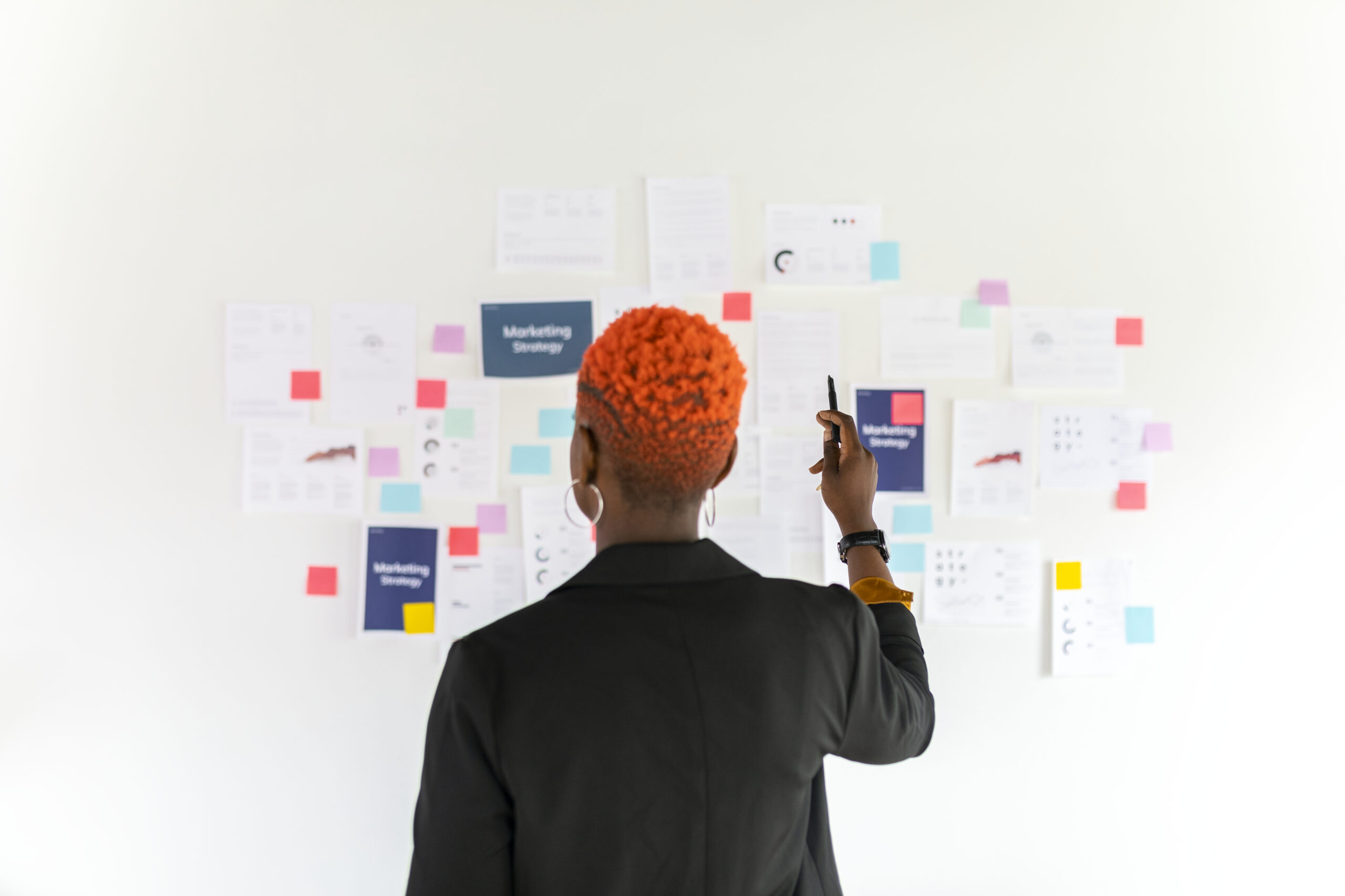 A black woman planning a marketing strategy