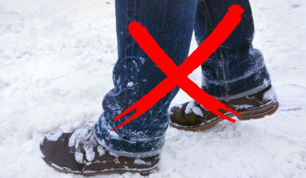 man wearing jeans and snow boots during winter