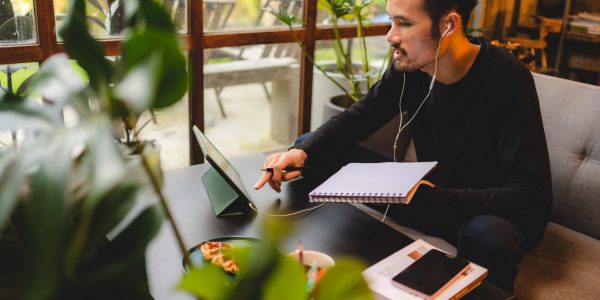 young man person using computer laptop or tablet for work and learning online communication from home, cyberspace education technology for business people or student using to work, hipster businessman